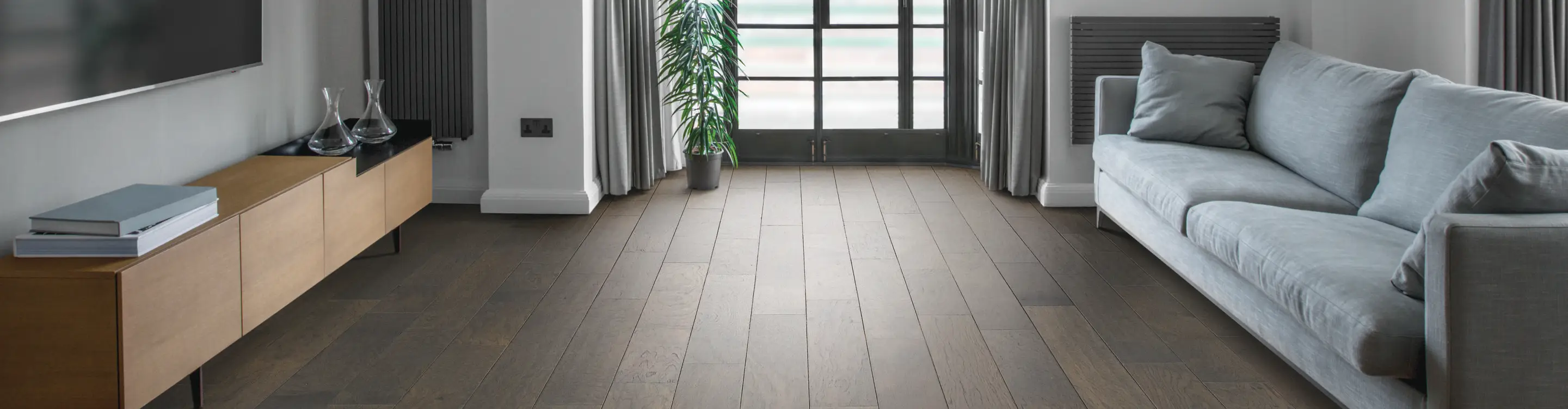 dark hardwood in a living room with grey accents